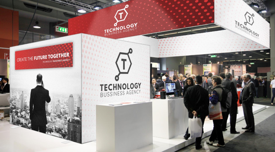 Conference hall with a Technology Business Agency booth.