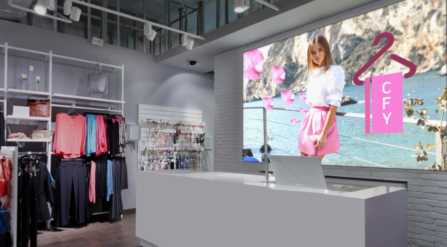 Clothing store interior with apparel racks and a large 